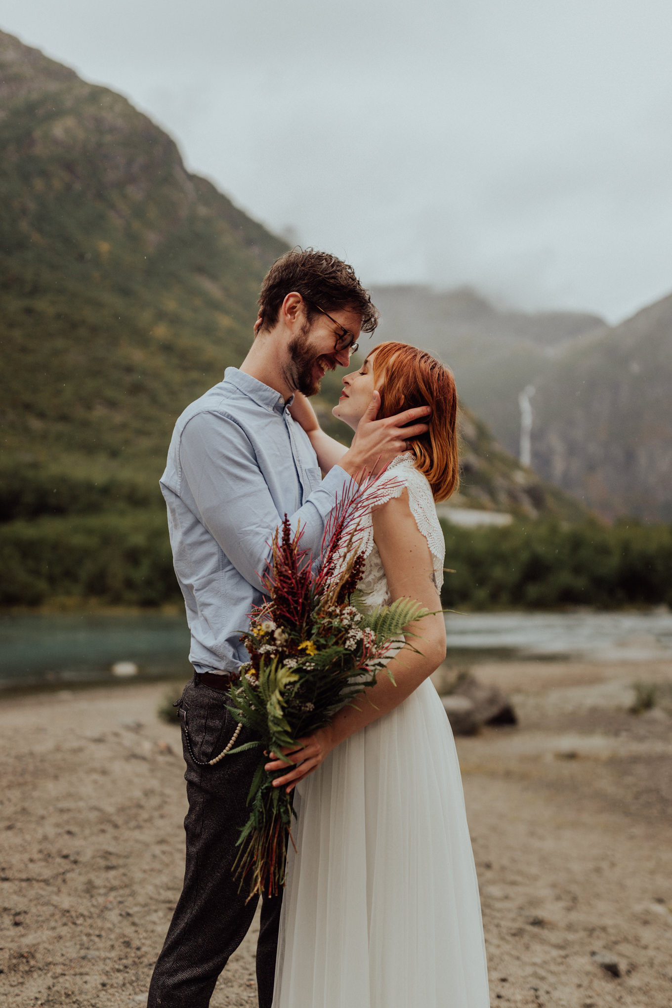 A young couple poses for elopement photos in southern Norway