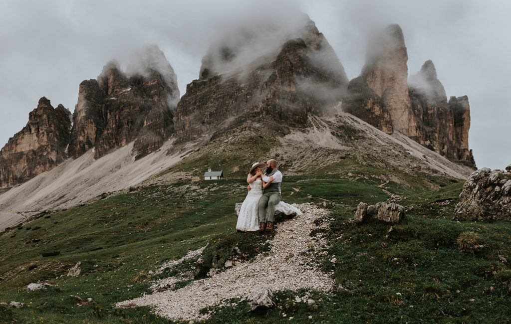 moody wedding photos at tre cime in june after the rain