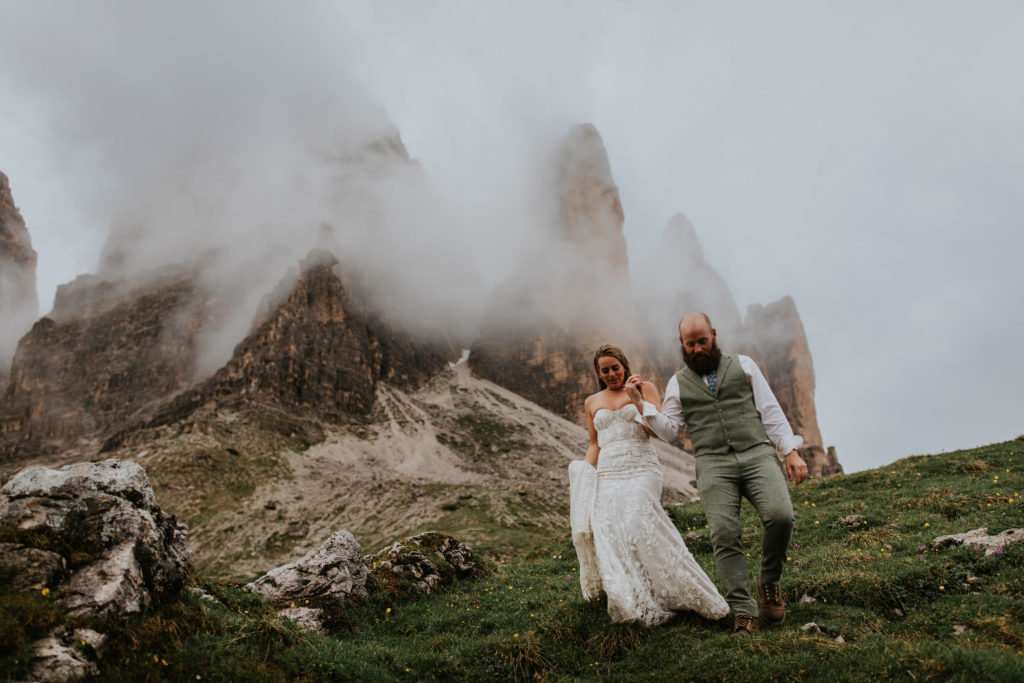 Couple walks along the Tre Cime trail during their Dolomites elopement 