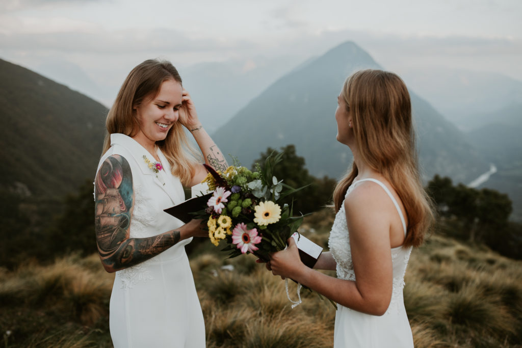 Couple reads their vows for their Slovenia elopement photography session.