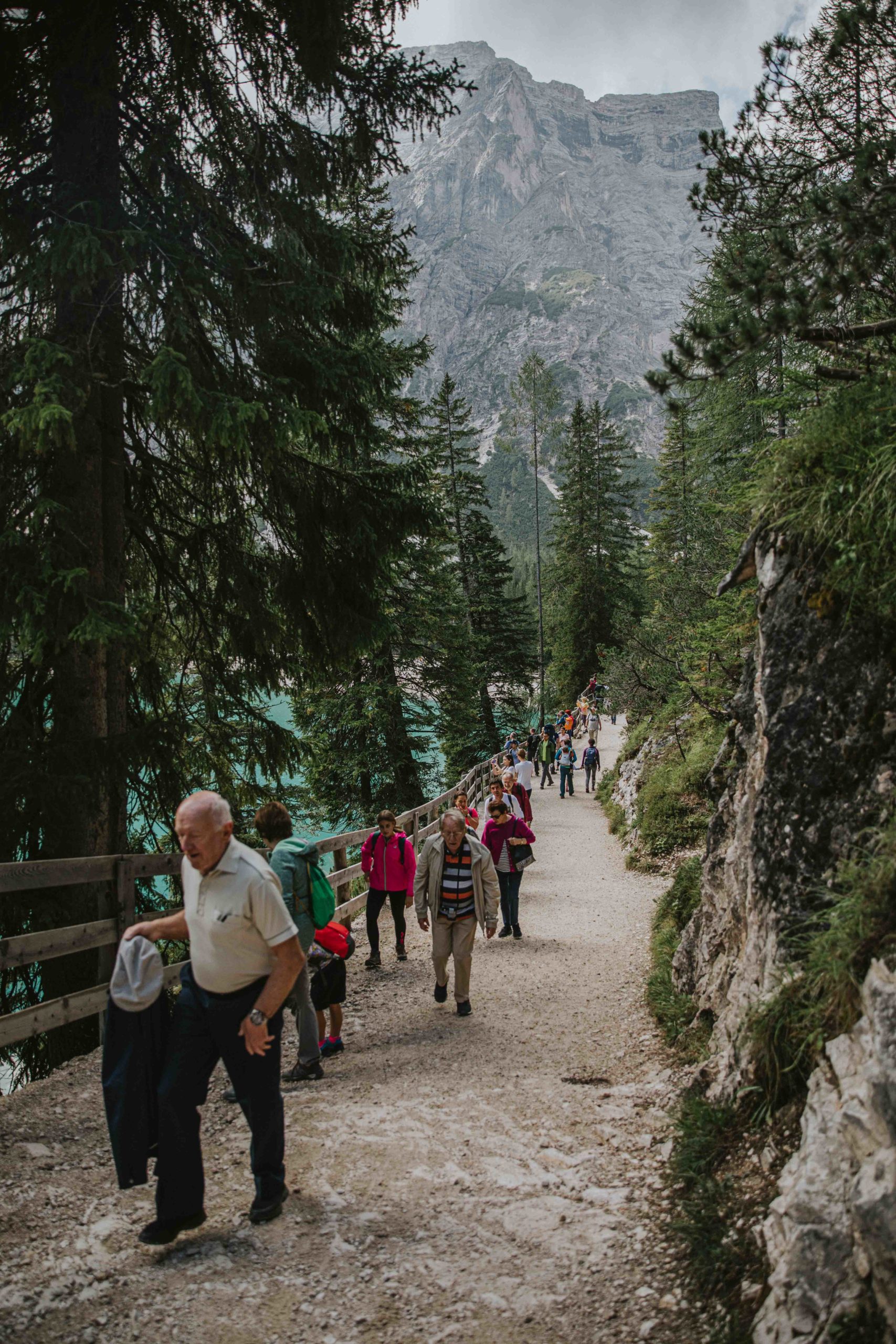 crowds at Lago di Braies walk along the stone trail midday