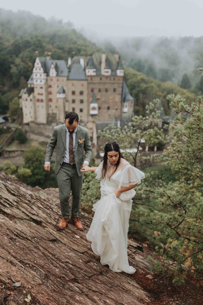 A couple walks near Burg Eltz during their elopement 
