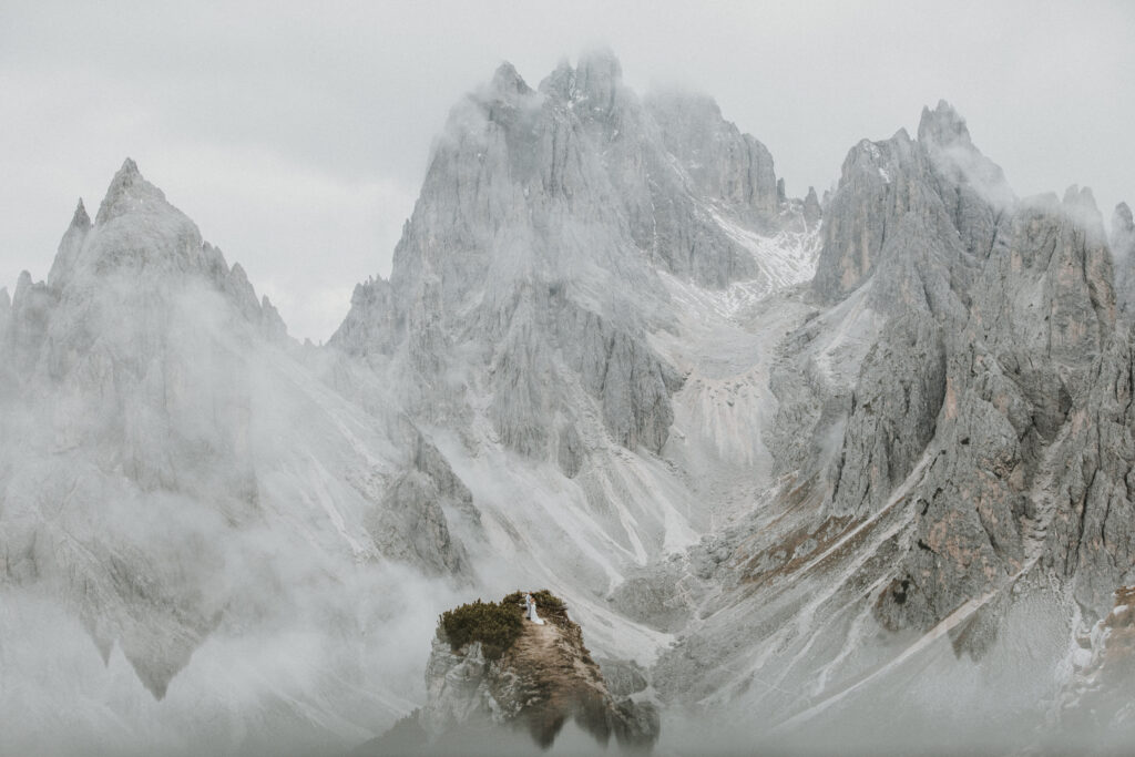 The dramatic, steel grey peaks of Cadini di Misurina in the Dolomites shrouded in mist