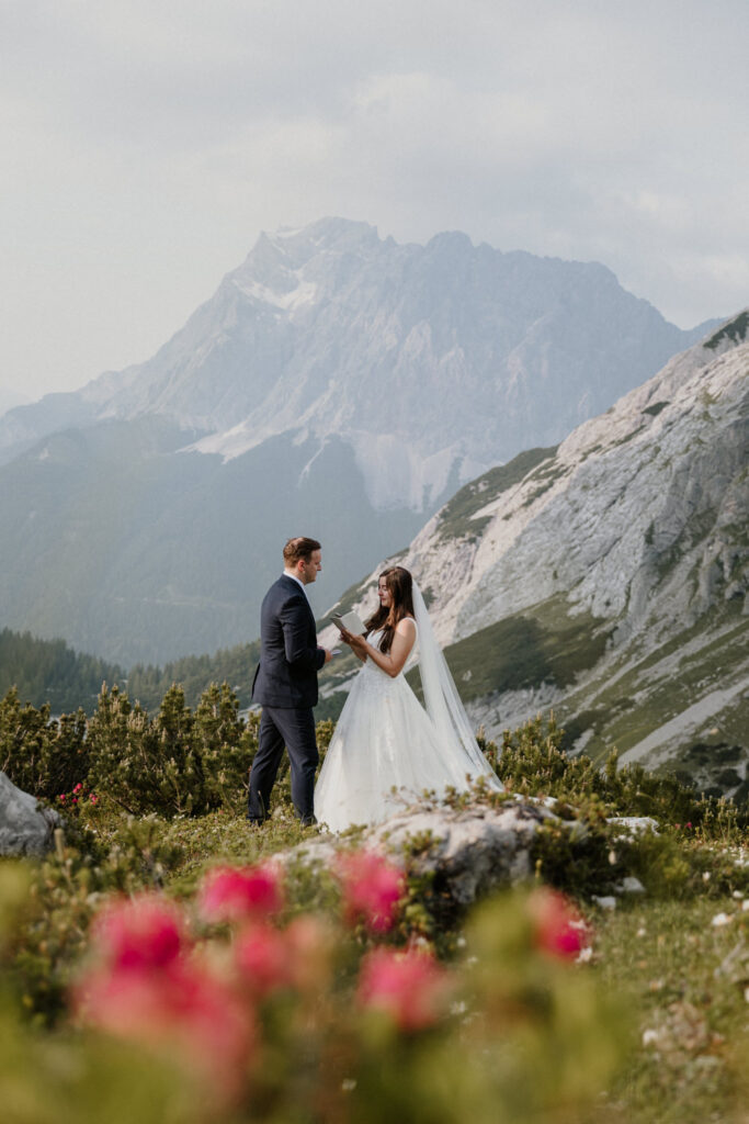 A couple reads their wedding vows in the Ehrwald Zugspitze region while eloping in Austria.