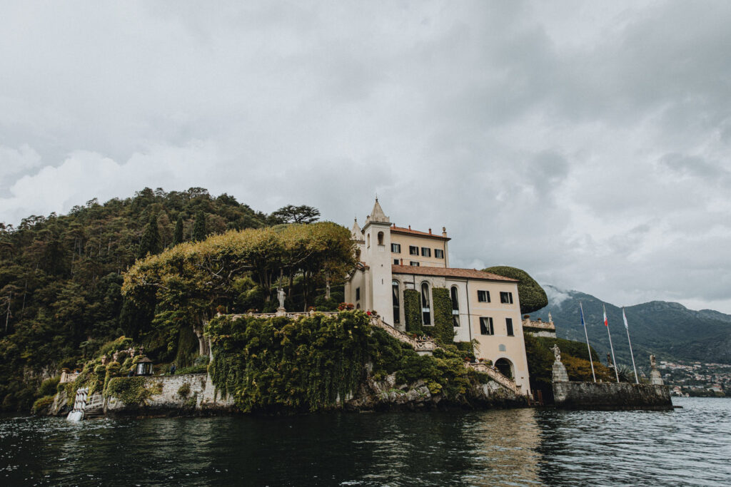 The impressive wedding venue and historical museum Villa del Balbianello is seen on an overcast day from the waters of Lake Como