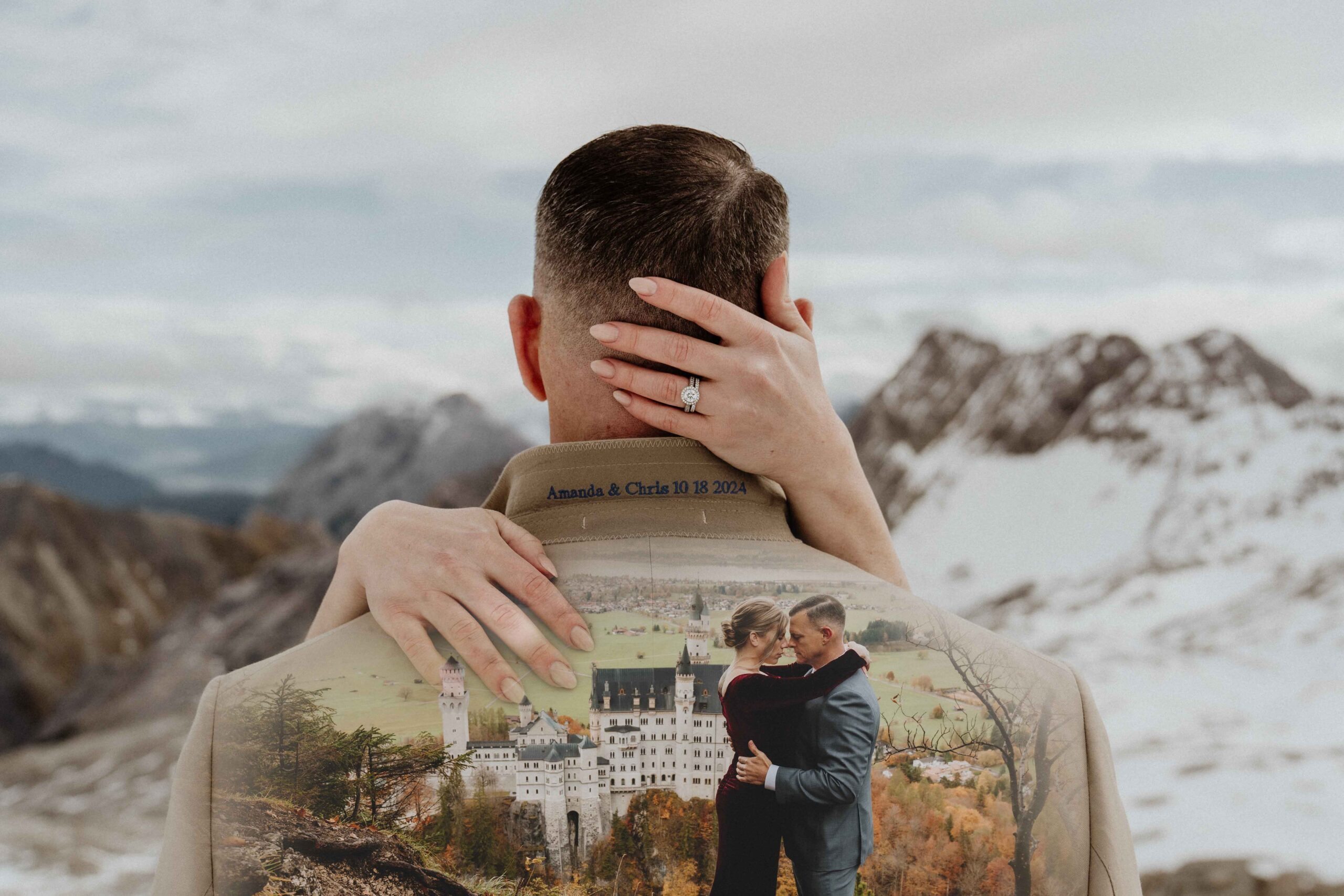 A double exposure image of a wedding couple posing for photos in front of Neuschwanstein castle, one image of her hand and wedding ring and other of them embracing in front of the castle.